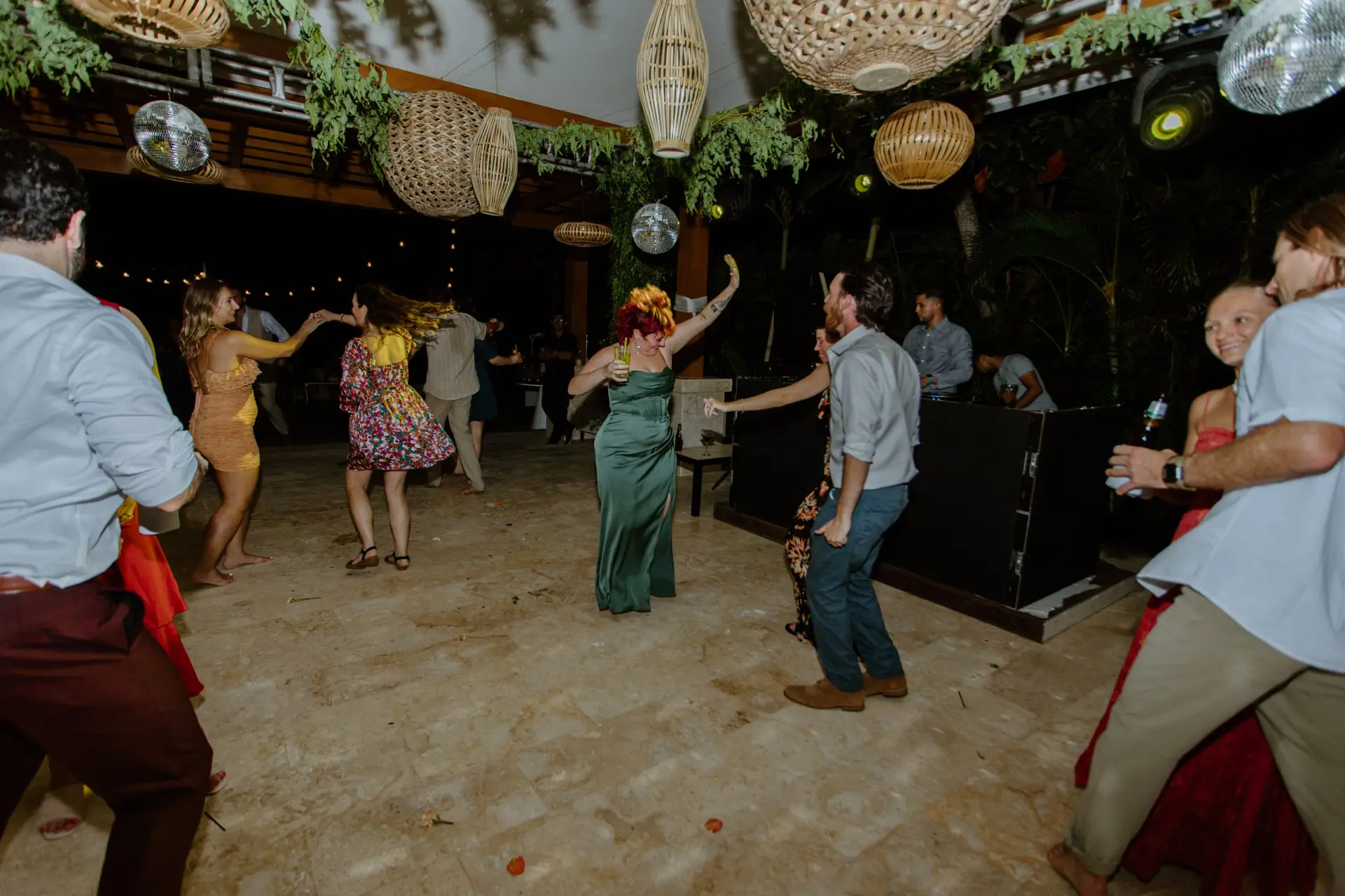Wedding guests dancing beneath the pavilion